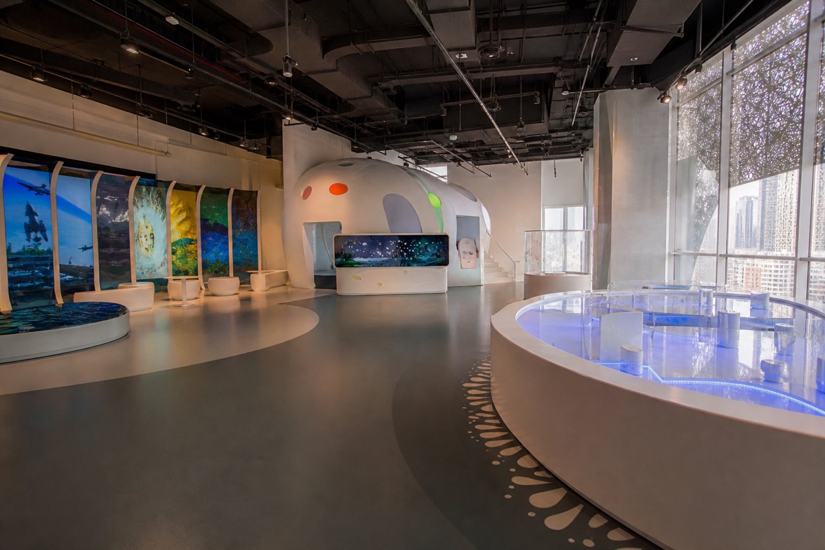 Families exploring the interactive floors of the Museum of the Future